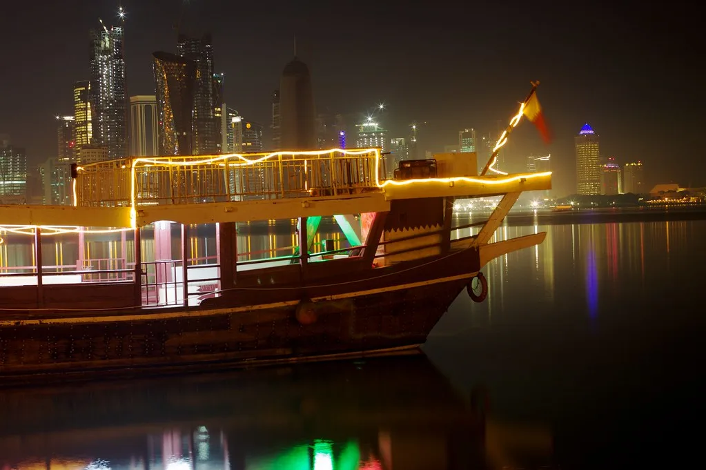 Illuminated dhow with the West Bay skyline behind, Doha