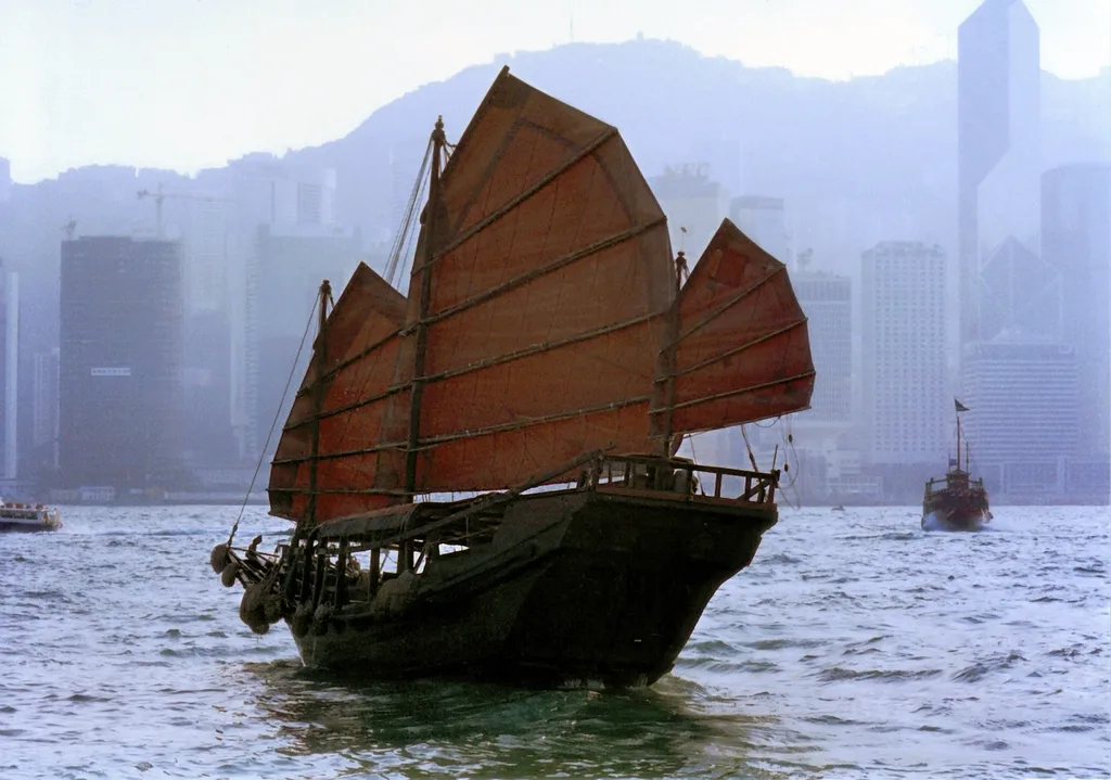 Traditional junk sailing Victoria Harbour, Hong Kong