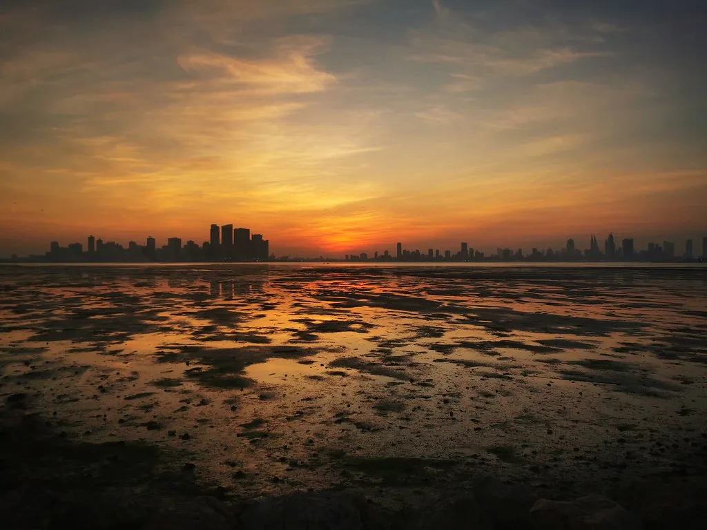 Manama skyline at sunset across Bahrain Bay