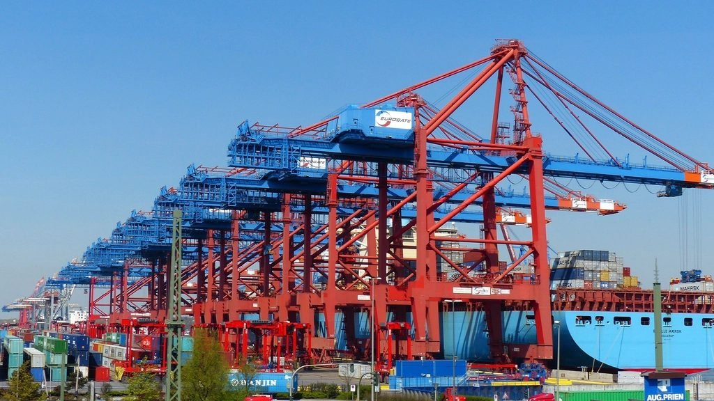 Container cranes over the port at dusk