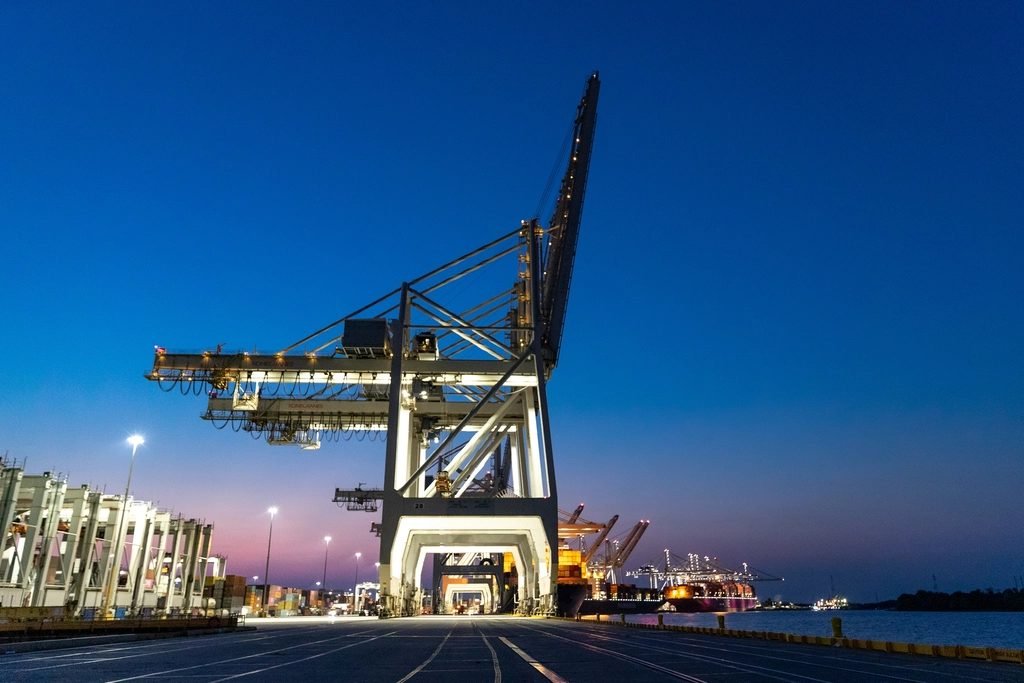 Quay cranes at a container port at dusk